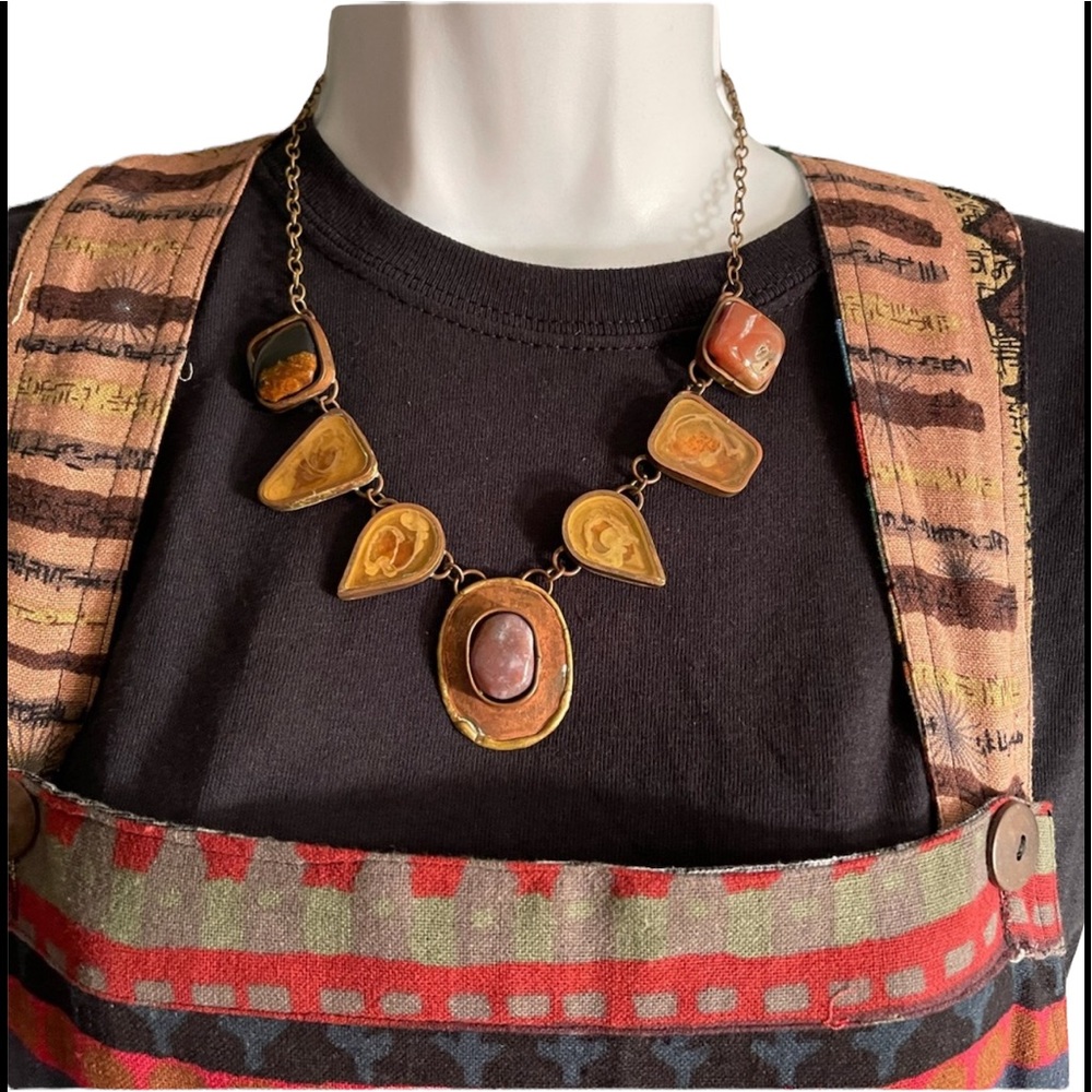 Vintage Necklace is 22 inches long. Unique and it isn’t new. BL/BL